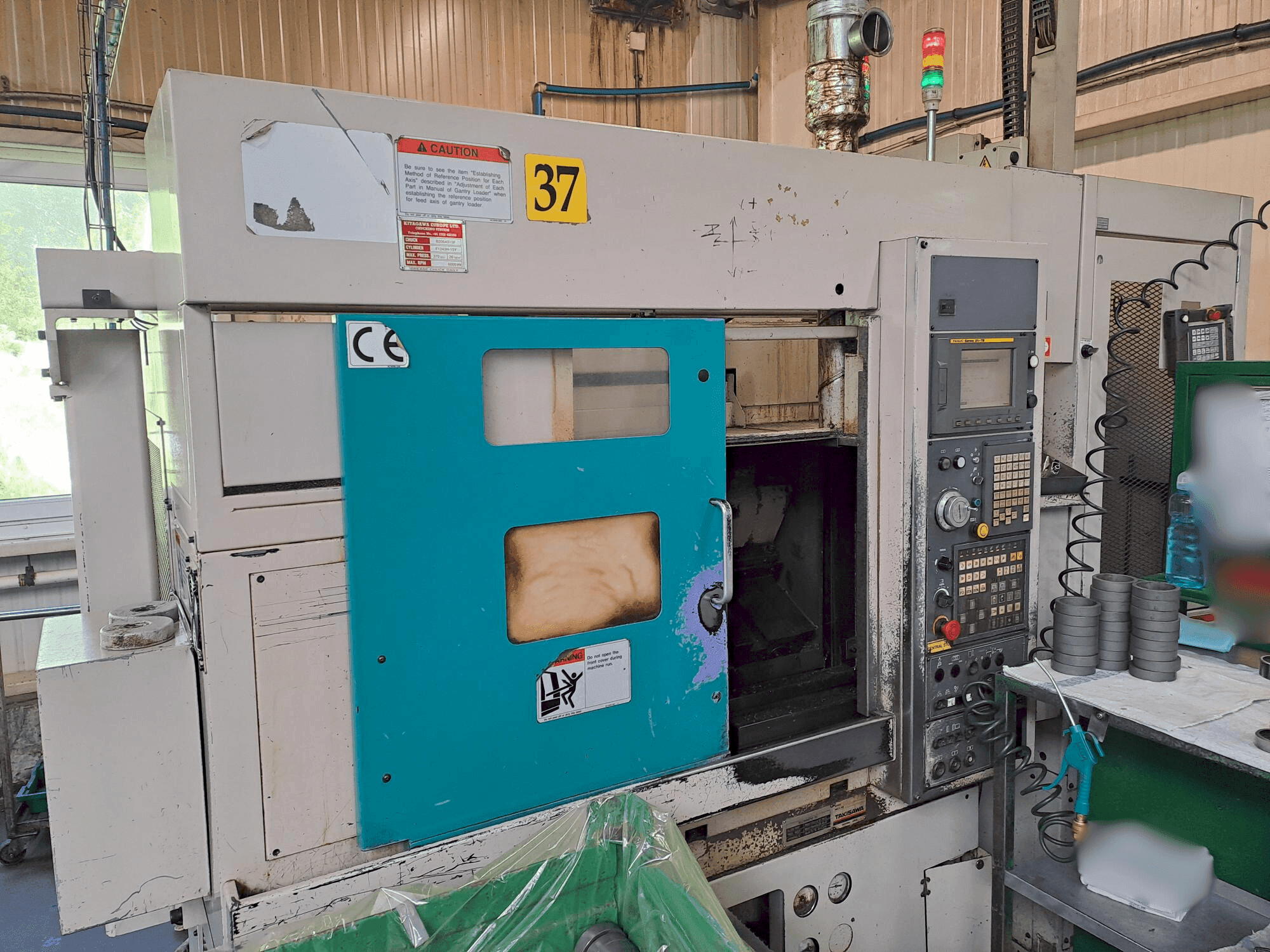 Takisawa TC 200 Mašinos vaizdas iš priekio