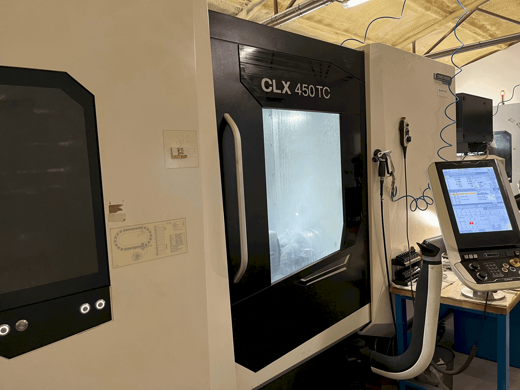 DMG MORI CLX 450 TC Mašinos vaizdas iš priekio