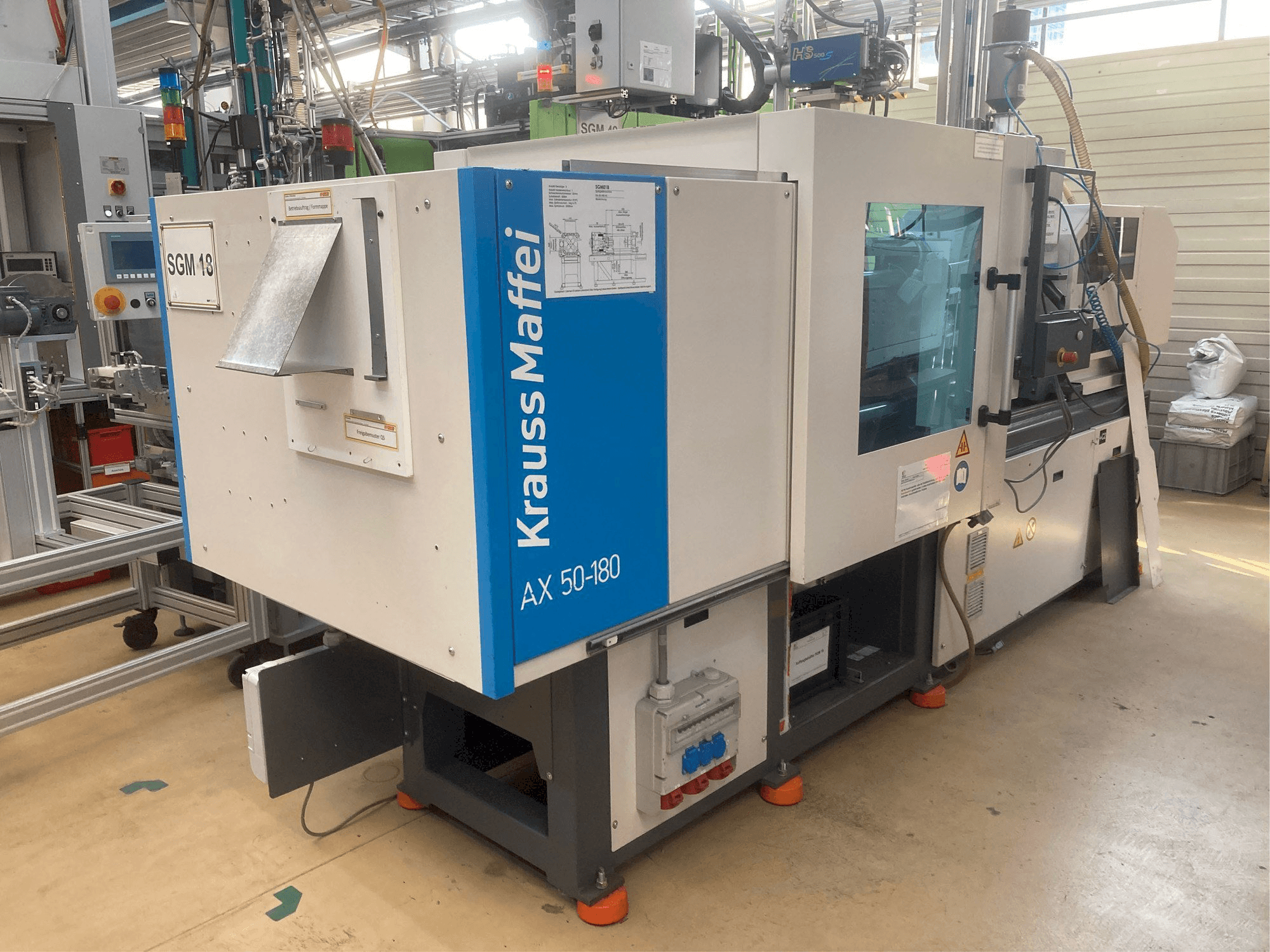 Krauss Maffei AX 50-180 Mašinos vaizdas iš kairės pusės