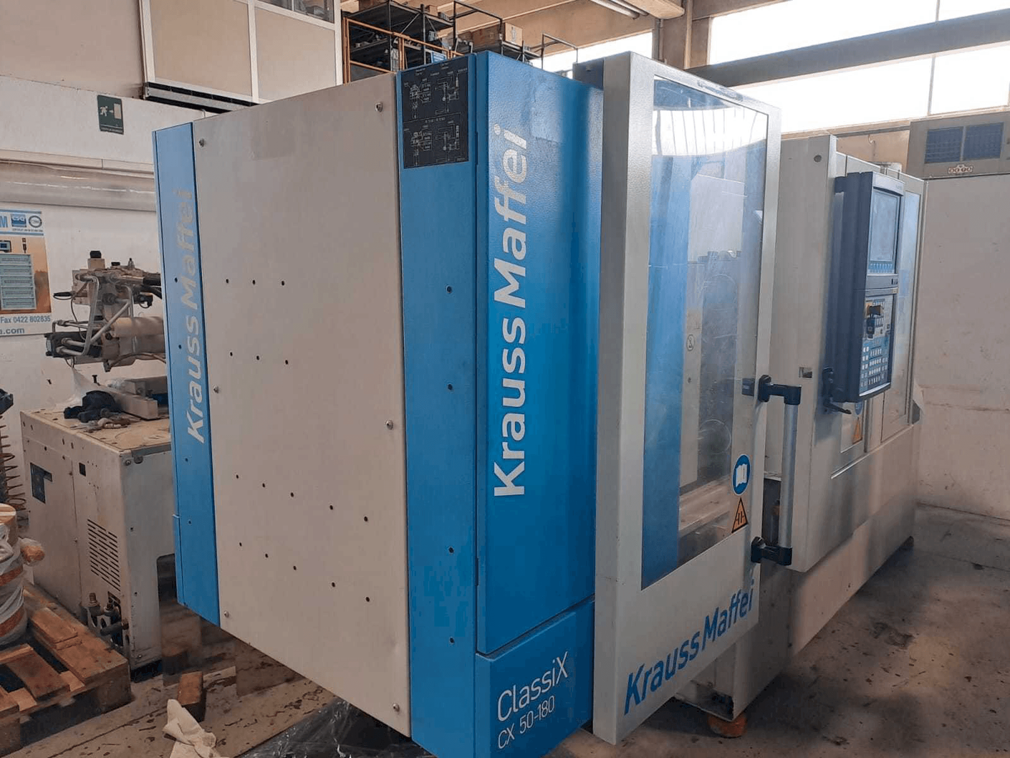 Krauss Maffei 50-180CX Mašinos kairės pusės vaizdas